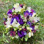 Bridal bouquet of purple lisianthus and freesias