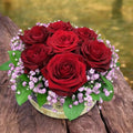 Elegant box with 7 red roses and the bride's flower - a gift for special moments!