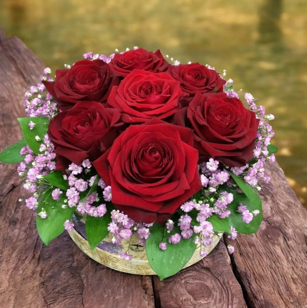 Elegant box with 7 red roses and the bride's flower - a gift for special moments!