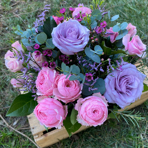 Box with lilac roses