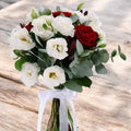 Bouquet of red roses and white lisianthus