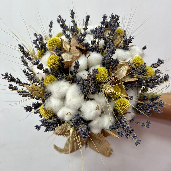 Lavender bridal bouquet, ears of wheat, cotton flowers and craspedia