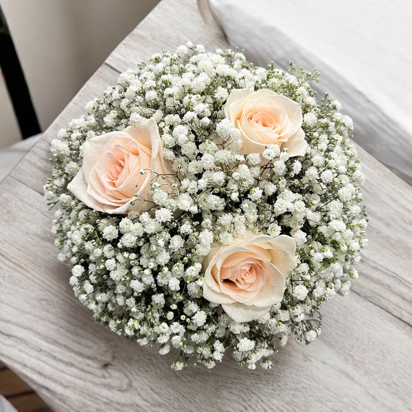 Bridesmaid bouquet, cream roses and the bride's flower
