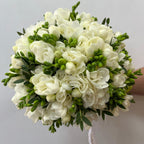 Wedding bouquet of fragrant white freesias