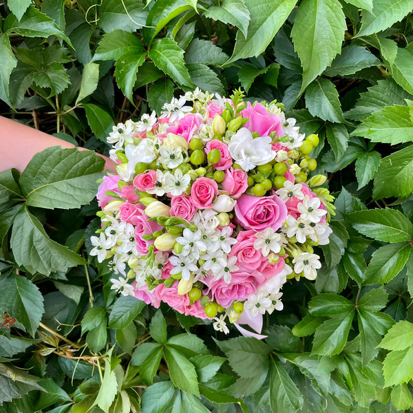 Bridal bouquet of roses, mini pink roses and ornithogalum