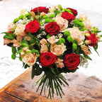 Bouquet to offer of red roses, santini and alstroemeria