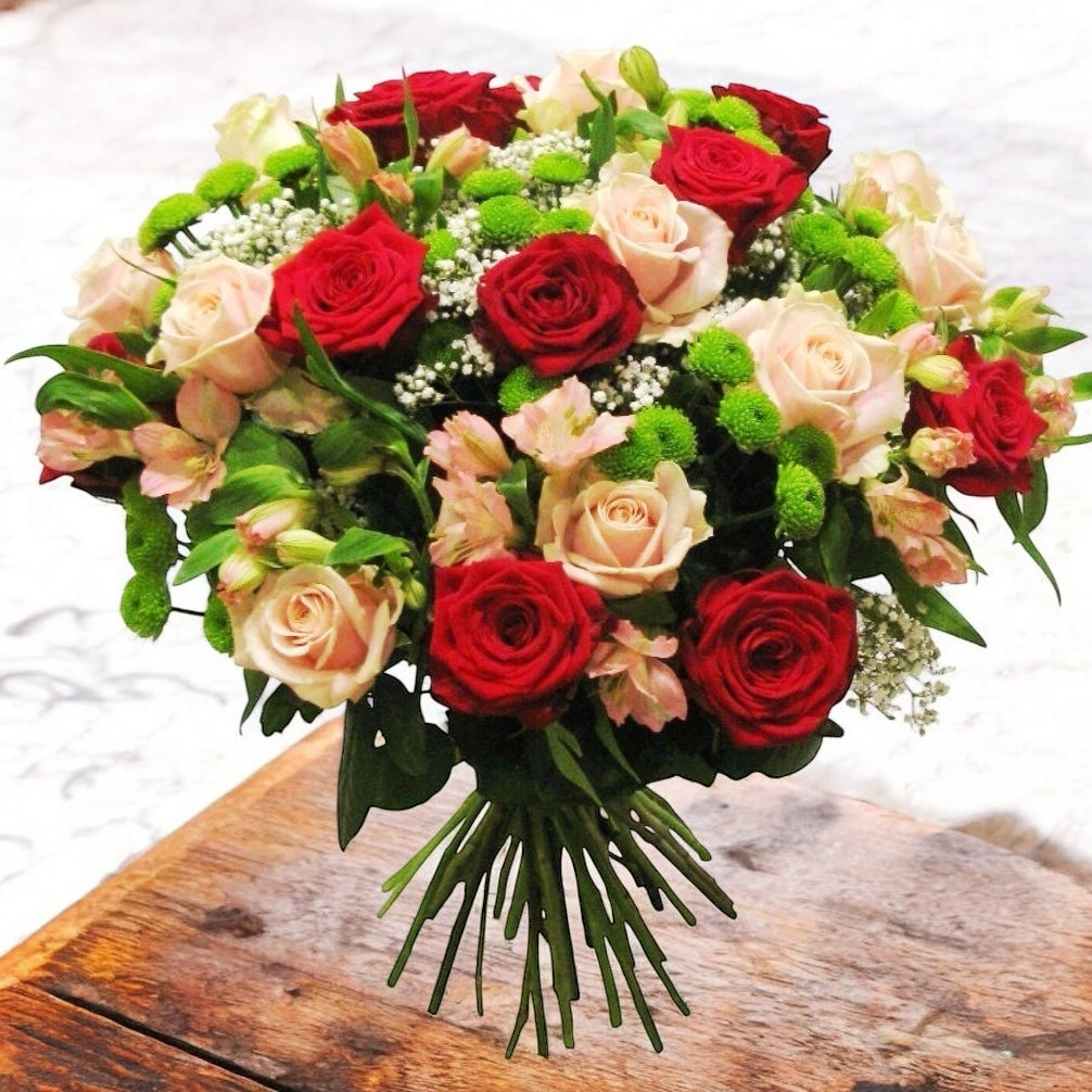 Bouquet to offer of red roses, santini and alstroemeria