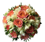 Bridal bouquet with miss piggy roses and white freesias