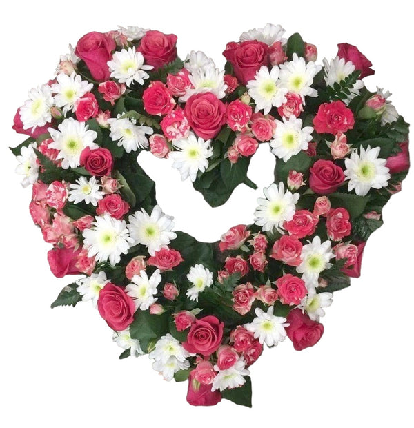 Funeral arrangement in the shape of a heart, cyclamen roses