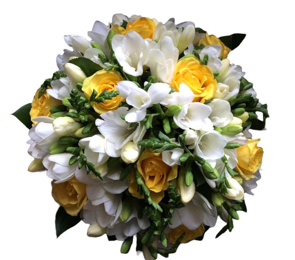 Wedding bouquet of yellow roses and white freesias