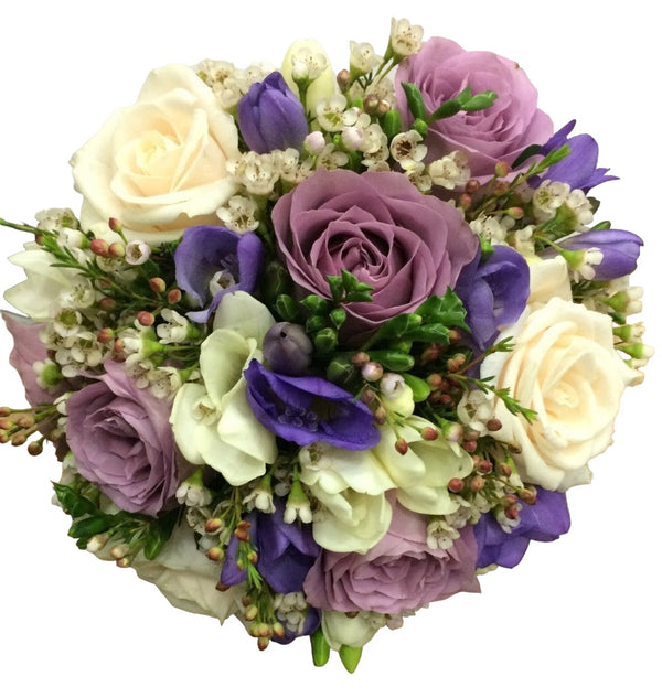 Pastel wedding bouquet with roses and freesias