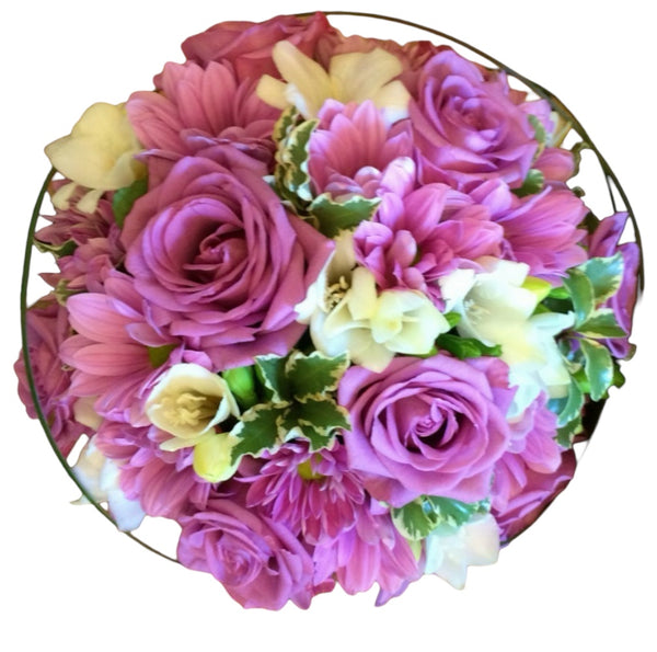 Purple bridal bouquet with roses, freesias and daisies