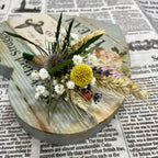 Bunches of natural flowers - ears of wheat, eryngium and craspedia