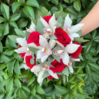 Wedding bouquet of red roses and cymbidium