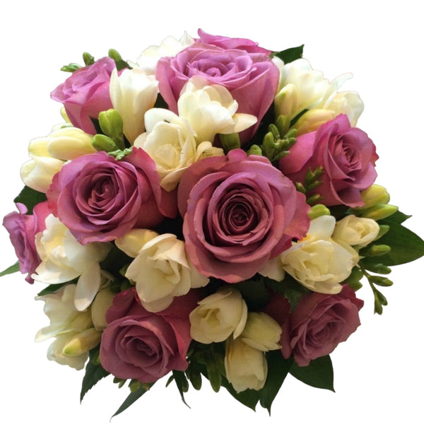 Bridal bouquet with purple roses and white freesias