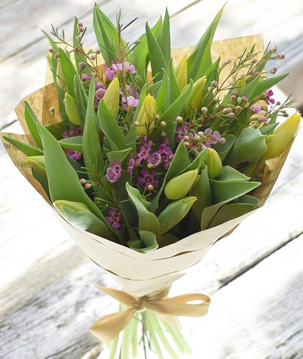 Bouquet of 15 yellow tulips and wax flowers