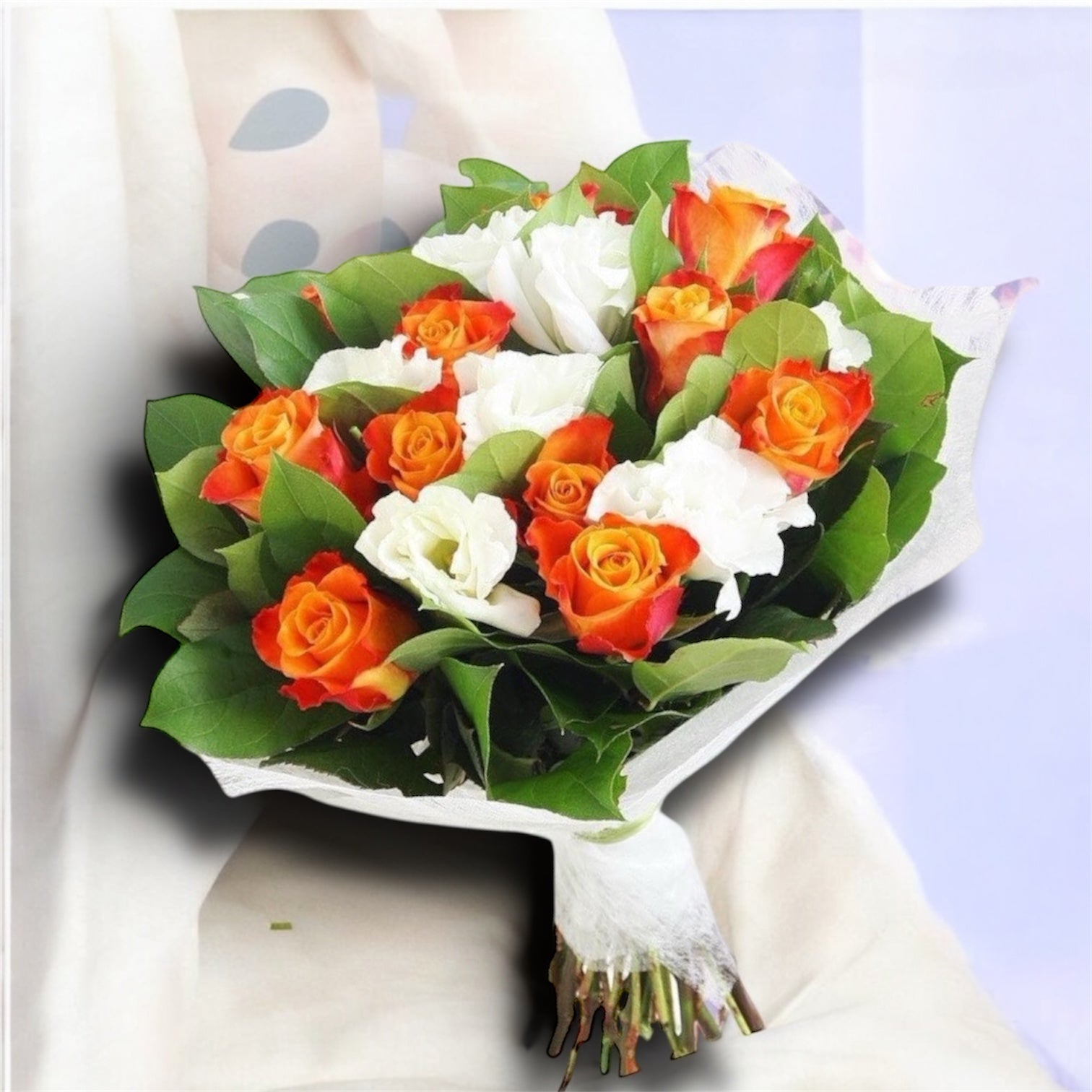 Bouquet of flowers from orange roses and lisianthus
