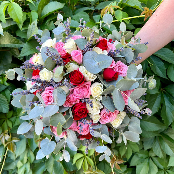 Bridal bouquet of mini roses and eucalyptus