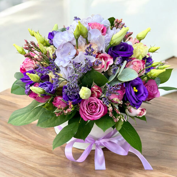 Box of mini pink lisianthus and hydrangea flowers