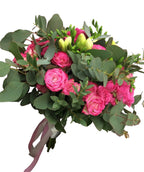 Wedding bouquet of white freesias and pink mini-roses