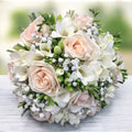 Bridal bouquet with purple roses and white freesias