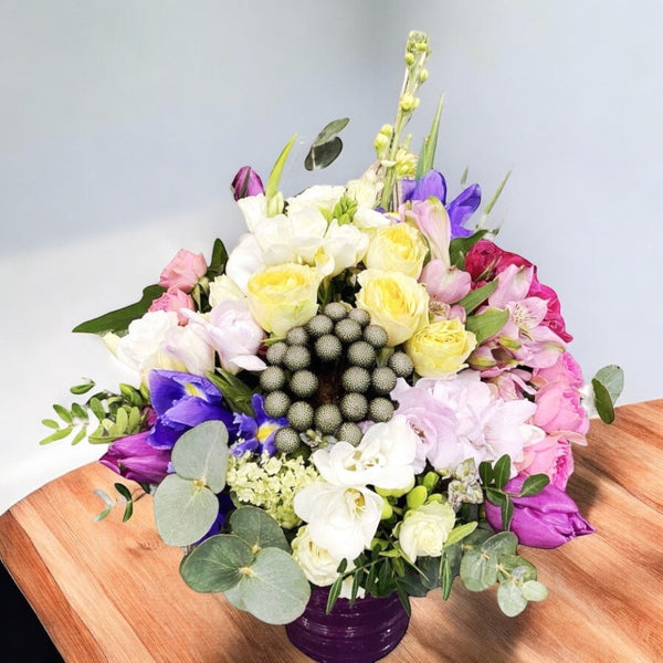 Arrangement with mini roses and eucalyptus