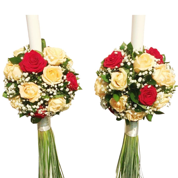 Red roses and peach wedding candles