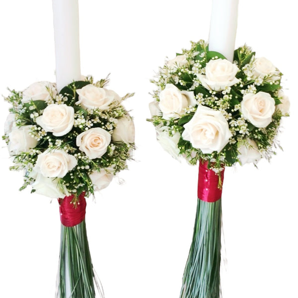 Wedding candles from cream roses and wax flowers