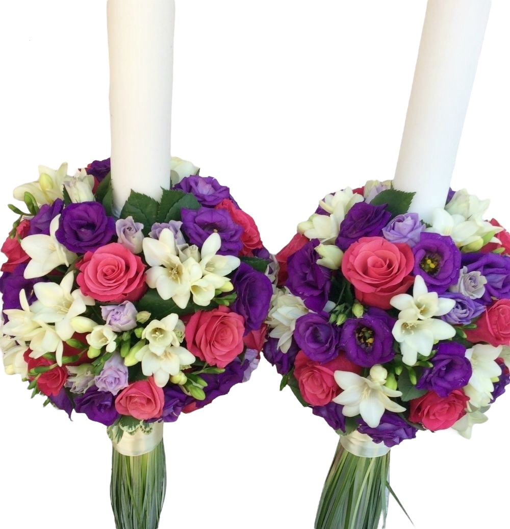 Wedding candles, cyclamen roses and freesias