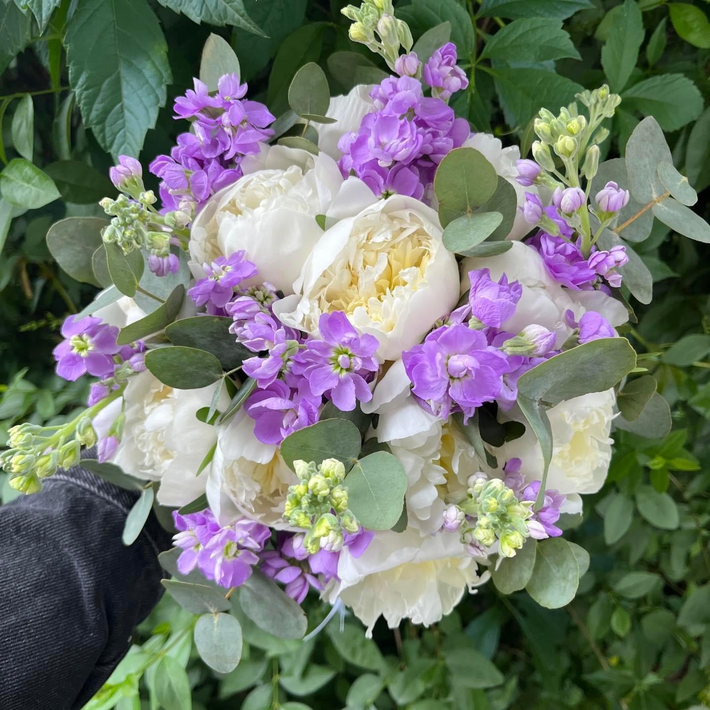 Bridal bouquet of peonies and lilac matthiola