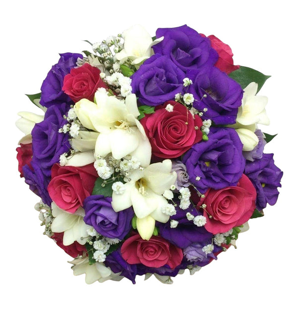 Colorful wedding bouquet of cyclamen roses and freesias
