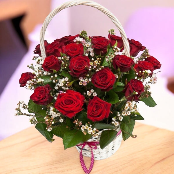 Basket with red roses and wax flowers