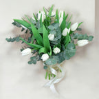 Spring bouquet with white tulips and eucalyptus