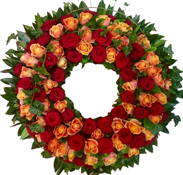 Coroana funerara rotunda din trandafiri rosii si portocalii