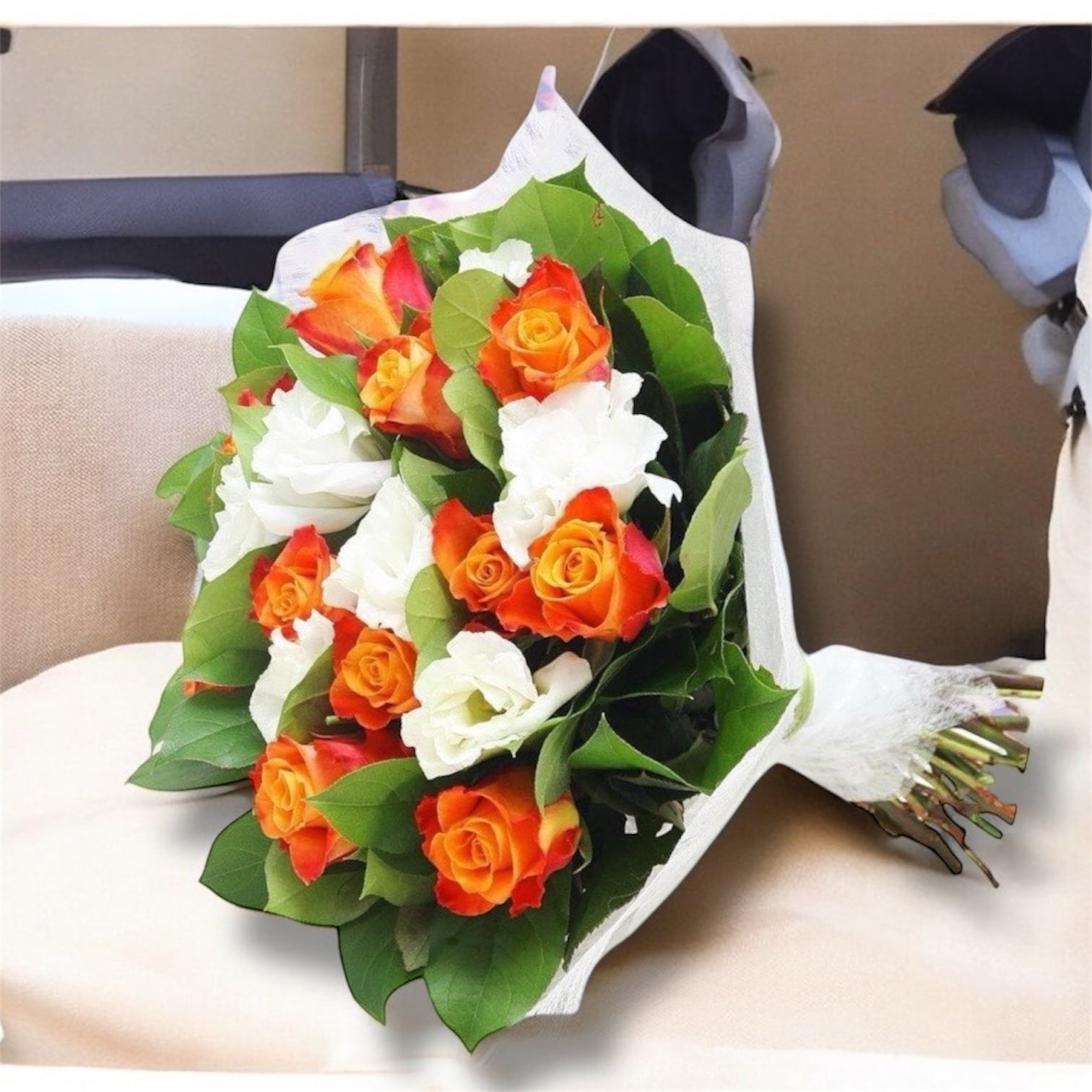 Bouquet of flowers from orange roses and lisianthus