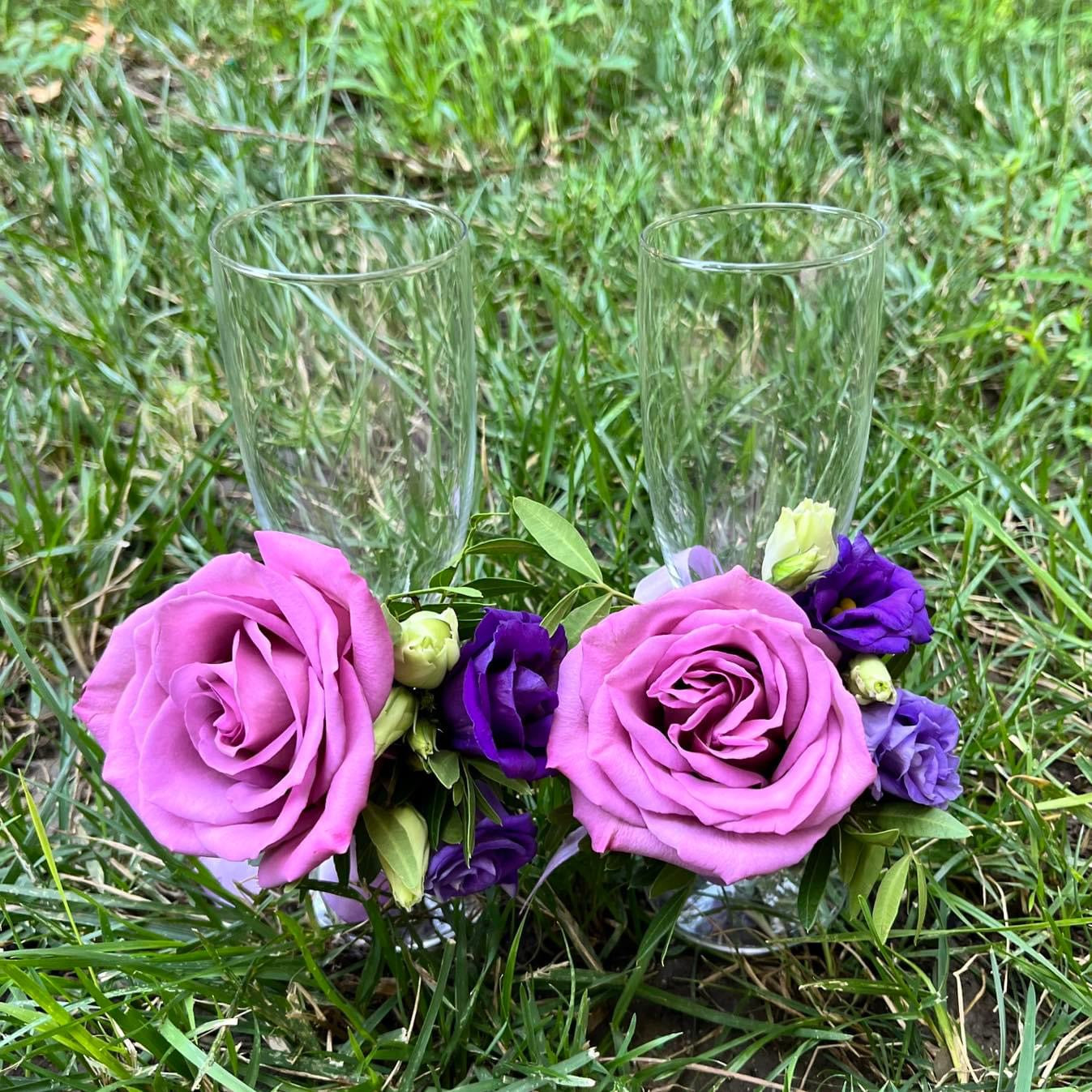 Wedding glasses decorated with purple roses and lisianthus