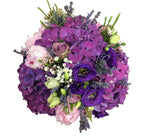 Bridal bouquet of pink peonies and purple hydrangea