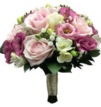 Wedding bouquet of pink roses and freesias