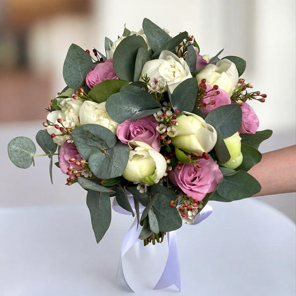 Bridal bouquet of peonies and roses