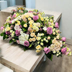 Funeral wreaths with mixed roses and freesias
