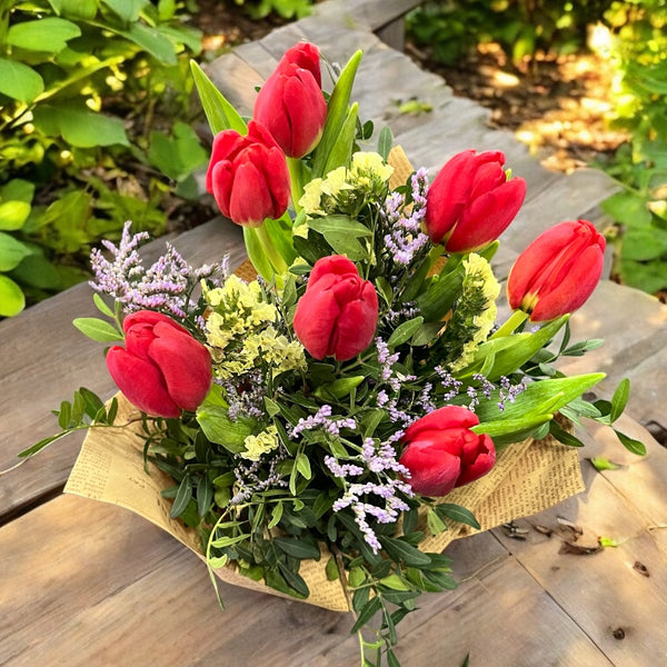 Bouquet of 7 yellow tulips and a butterfly