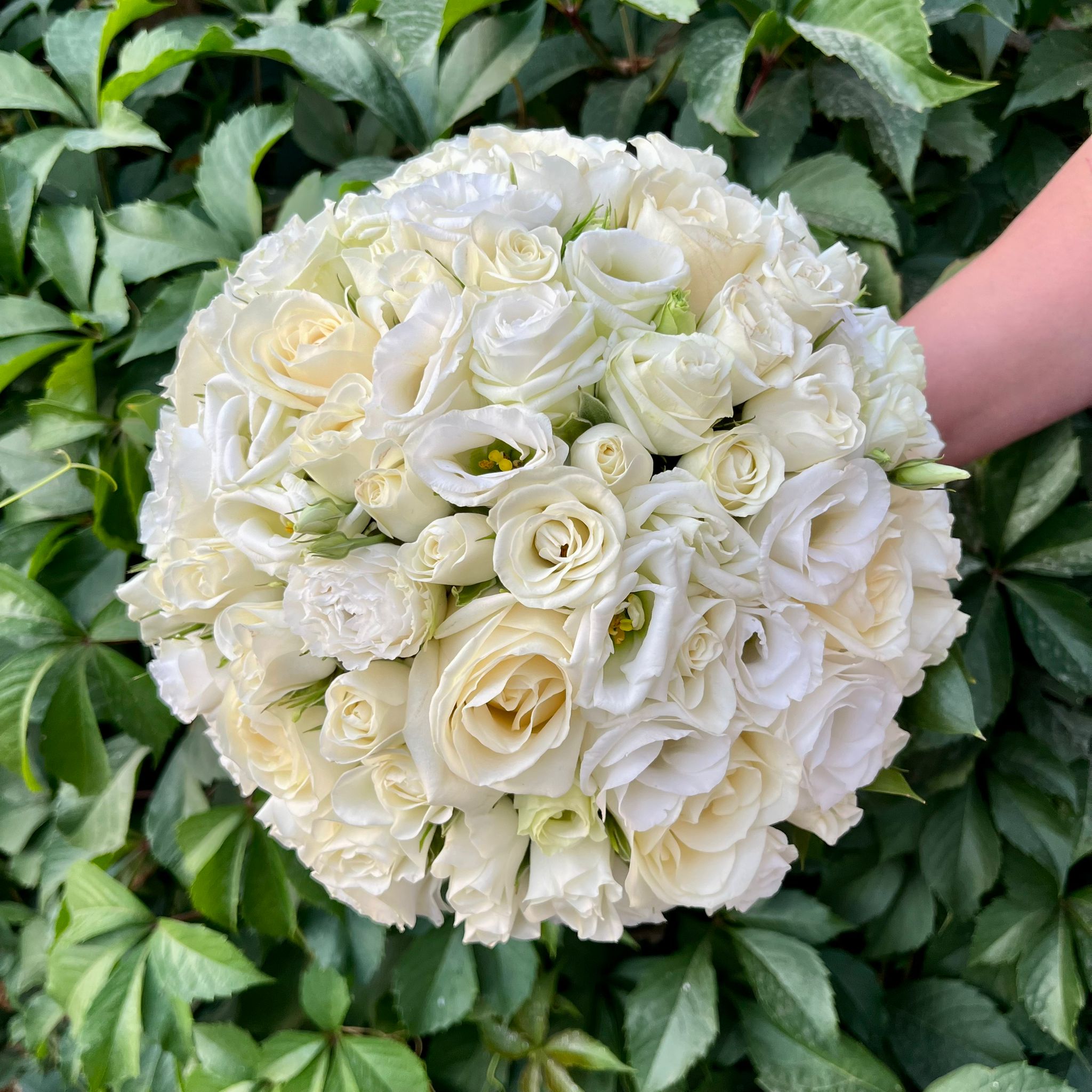 Bridal bouquet with ivory roses and white mini roses