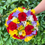 Colorful wedding bouquet of freesias and roses