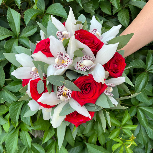 Wedding bouquet of red roses and cymbidium