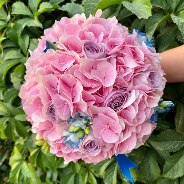 Bridal bouquet of pink hydrangea and lilac roses