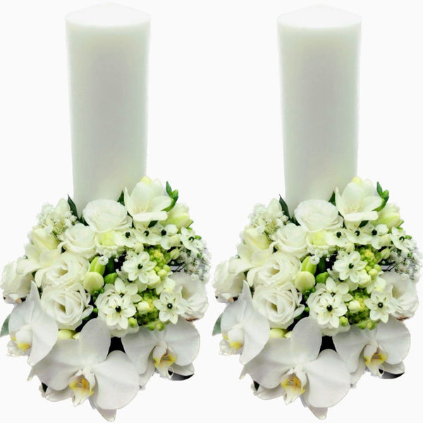 Short lisianthus, freesia and orchid wedding candles