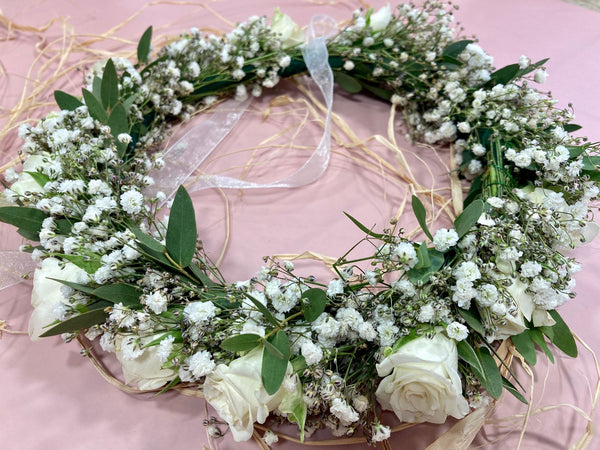 Flower crown made of white mini roses and the bride's flower