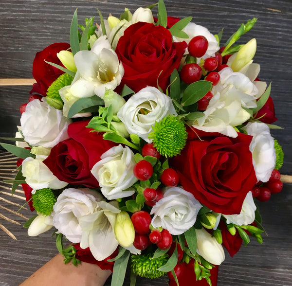 Bridal bouquet of red roses and santini