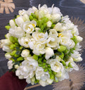 Wedding bouquet of fragrant white freesias