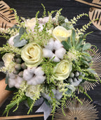 Bridal bouquet of lilac, astilbe and brunia roses